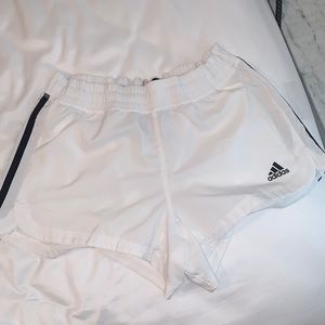 White adidas athletic shorts with no liner and black three stripe detail